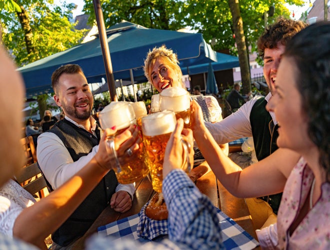 merry people drinking beer oktoberfest.jpg