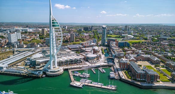 Photo of aerial view of Spinnaker Tower and Portsmouth Harbour, England.