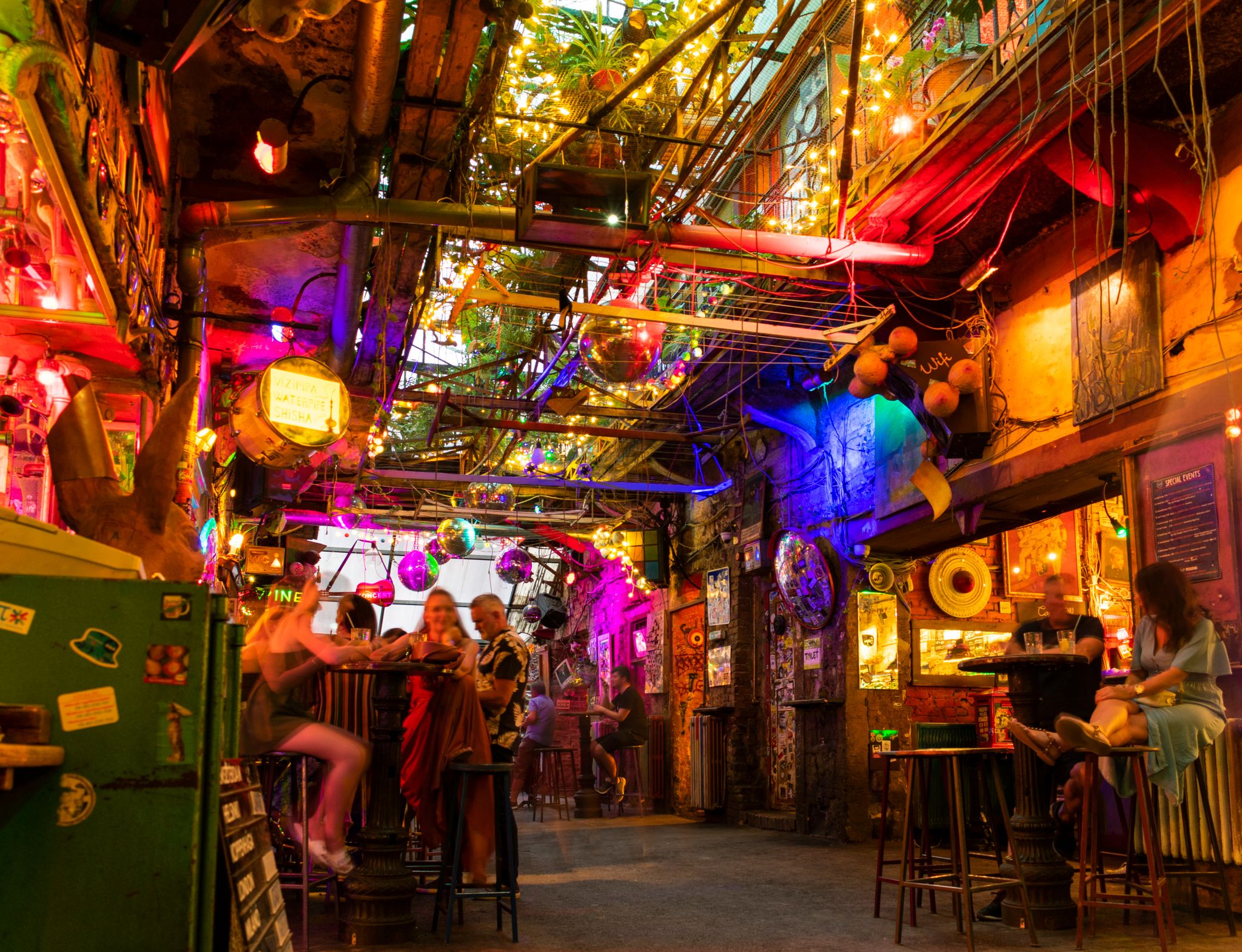 Photo of Interior of Szimpla Kert at night, the most famous ruin pub in Budapest, Hungary.