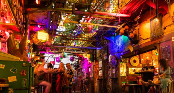 Photo of Interior of Szimpla Kert at night, the most famous ruin pub in Budapest, Hungary.