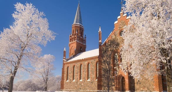 Photo of Church of St. Paul in winter in Viljandi, Estonia, the church was built in 1863-1866 in Neo-Gothic style with elements of Tudor Gothic.