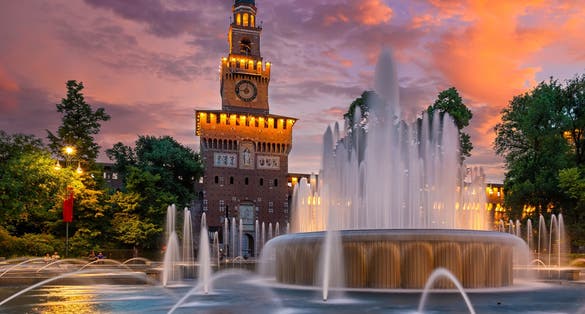 photo of Sunset view of Sforza Castle (Castello Sforzesco) in Milan, Italy. Architecture and landmarks of Milan. Night cityscape of Milan