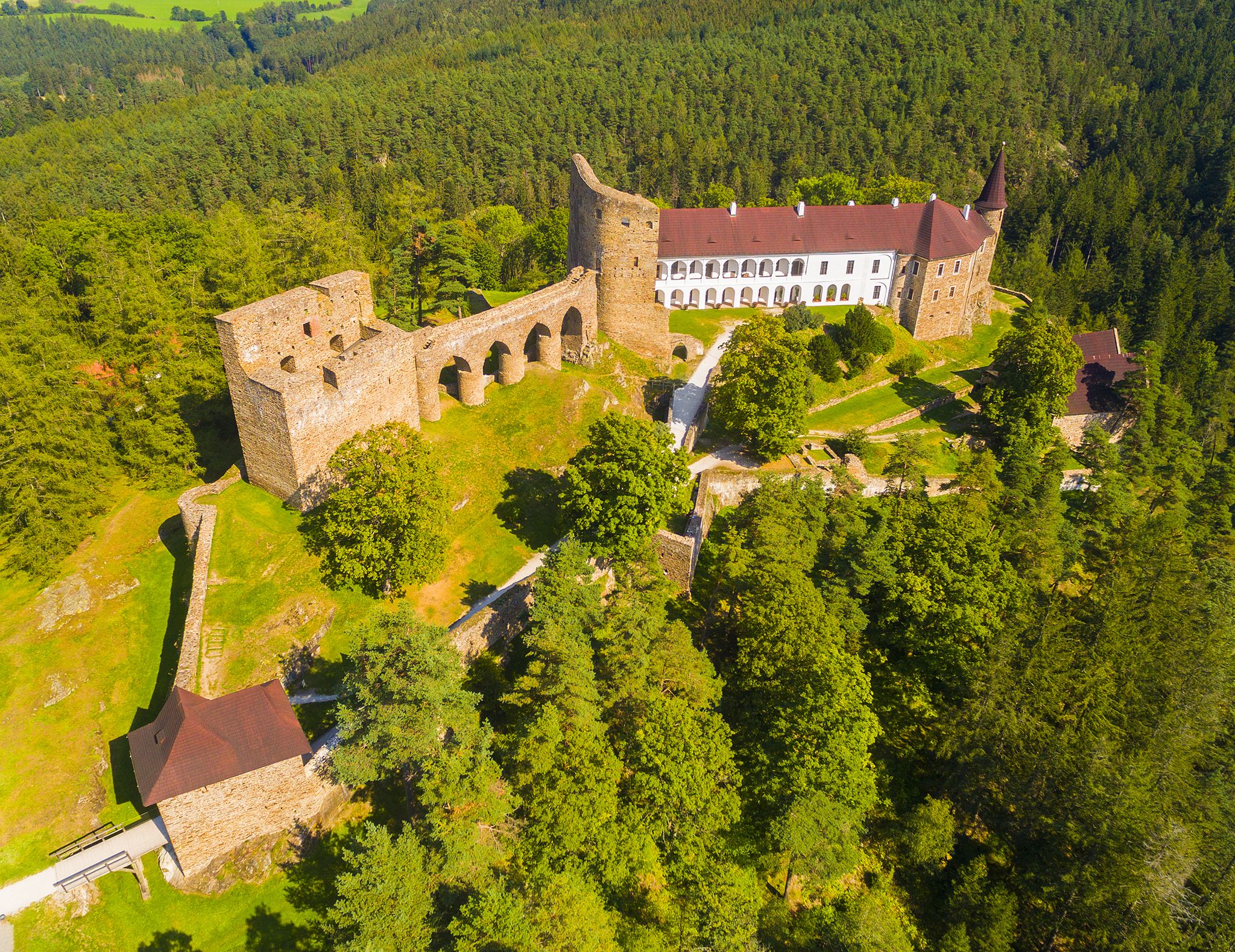 Photo of aerial view to medieval Velhartice Castle in Czech Republic.