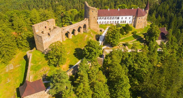 Photo of aerial view to medieval Velhartice Castle in Czech Republic.