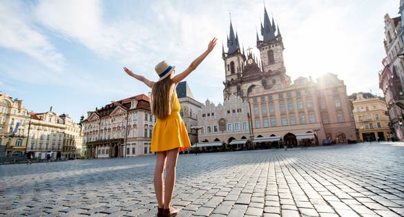 Photo of tourist dressed in the old town square of Prague, Czech Republic.