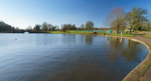Photo of Verulam lake at Verulamium park in St. Albans at sunny day, England.