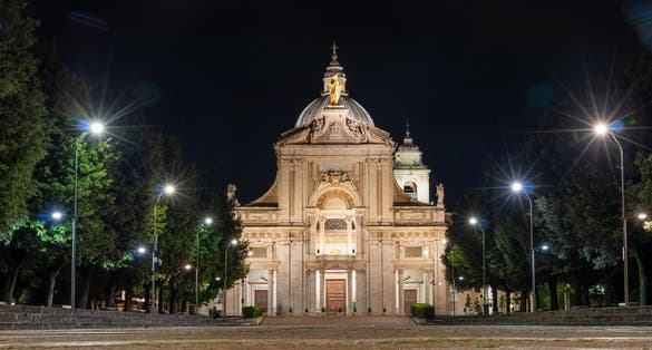 iIluminated facade of the Papal Basilica of Saint Mary of the Angels in Santa Maria degli Angeli, Assisi, region of Umbria, Italy.