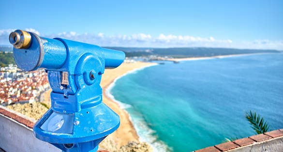 Photo of Nazaré Beach: Breathtaking Portuguese coastal gem, renowned for towering waves, stunning cliffs, Portugal.