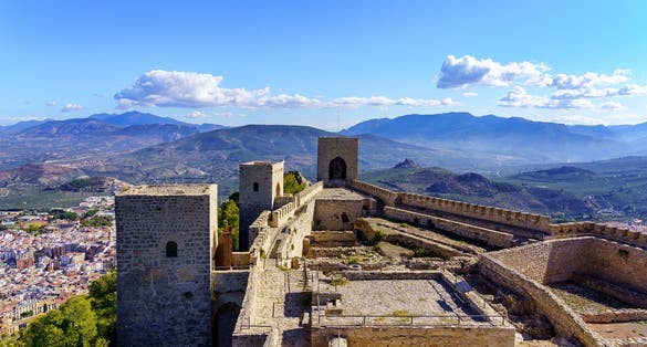 Medieval castle on top of a mountain with the city of Jaen below. Santa Catalina.