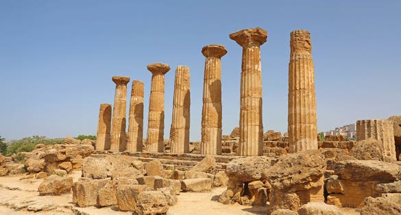 Ruined Temple of Heracles columns in famous ancient Valley of Temples of Agrigento, Sicily, Italy. UNESCO World Heritage Site.