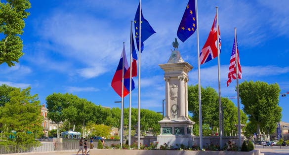 Memory Monument for soldiers killed in World Wars 1914-1918 and 1939-1941 Narbonne France among green trees