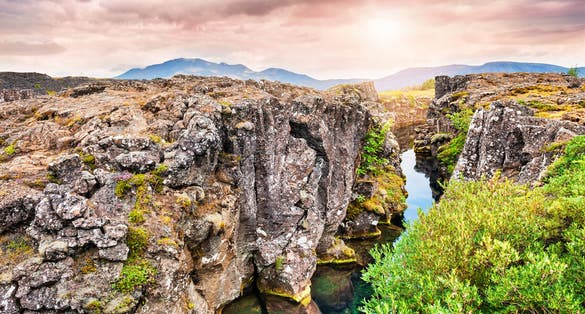 photo of beautiful cliffs and deep fissure in thingvellir national park. Southern Iceland.