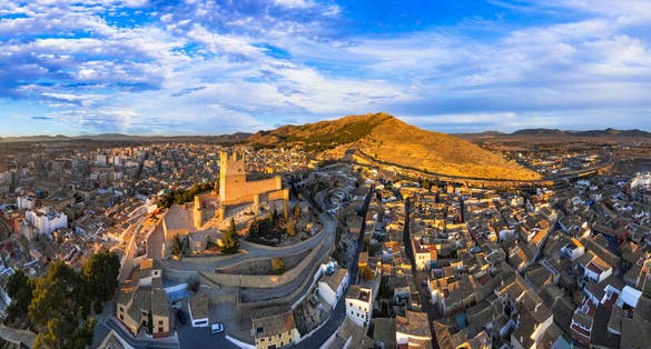 Photo of Scenic medieval towns and castles of Spain - Castillo de la Atalaya, Alicante province. Aerial drone panoramic view.