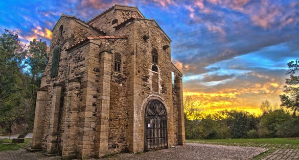 photo of view of The church of Santa Maria del Naranco was originally the royal hall (aula regia) of the palace of King Ramiro. Oviedo, Spain.