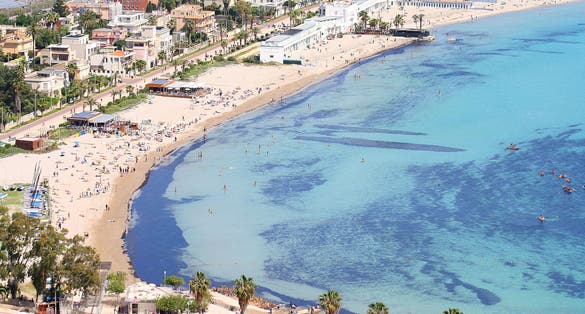 Photo of aerial view of beautiful Poetto beach in Cagliari, Sardinia, Italy.