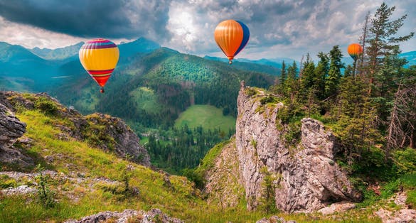 Magnificent Tatra Mountains with hot air balloons. Mountain scenery, amazing panorama with beautiful views. Poland, Zakopane. Amazing adventure ballooning. High Tatras mountains.