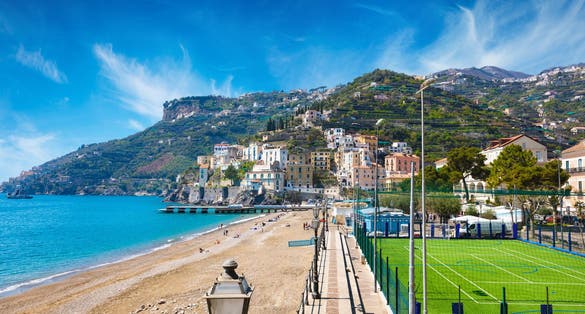 photo of view of  Blue sea and beach in Minori, seaside town at Amalfi Coast, province of Salerno, in Campania region of south-western Italy. Amalfitana is most popular travel and holiday destination in Europe