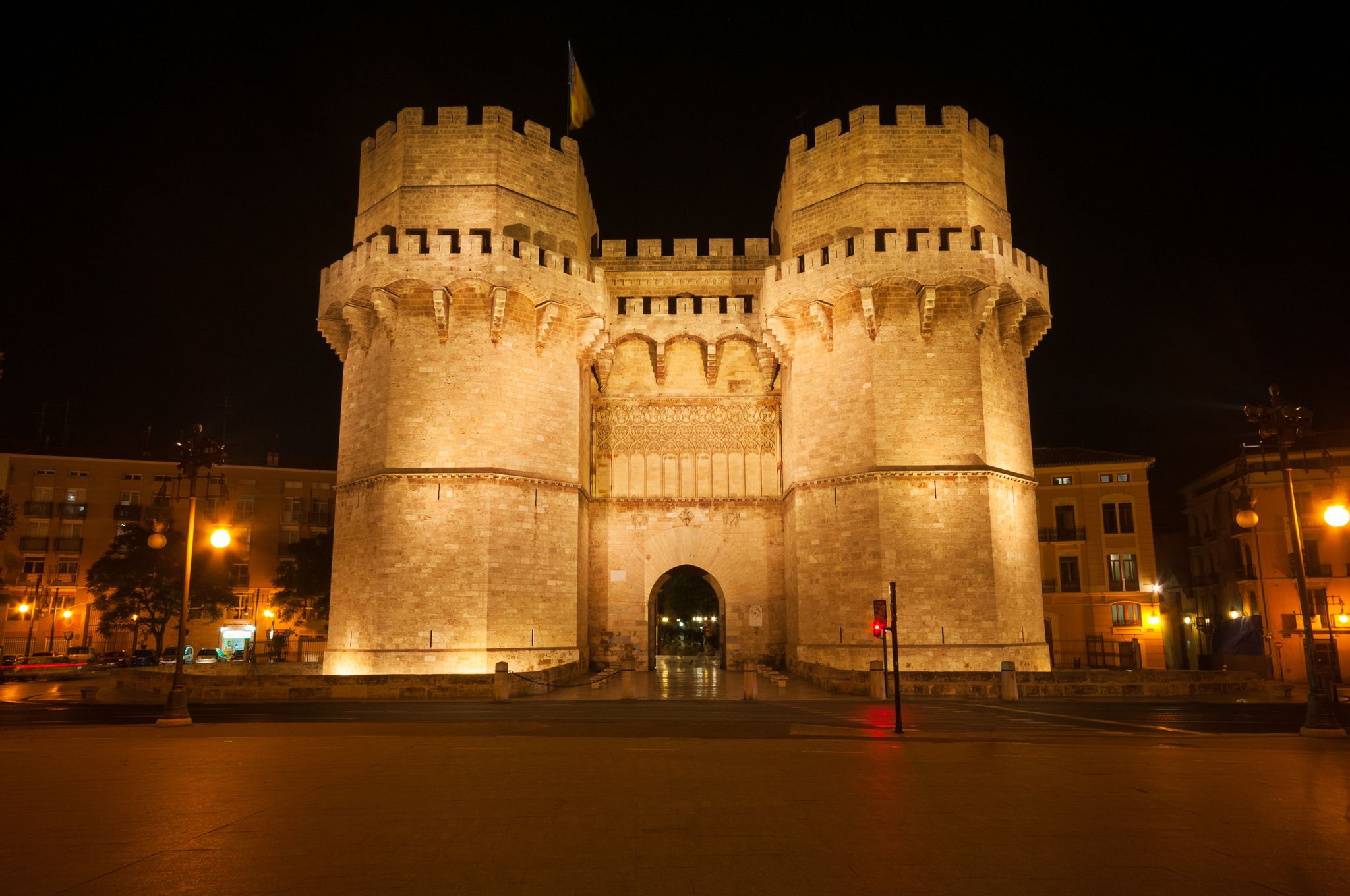 Photo of City landscape with Serrano Towers at night in Valencia, Spain .