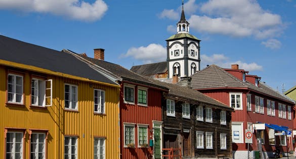 photo of view of Row of houses and church tower in Roros, Sor-Trondelag, Trondelag, Norway.