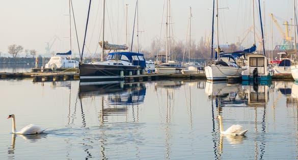 Many boats and yachts anchored at the touristic port or harbor in Mangalia, Constanta