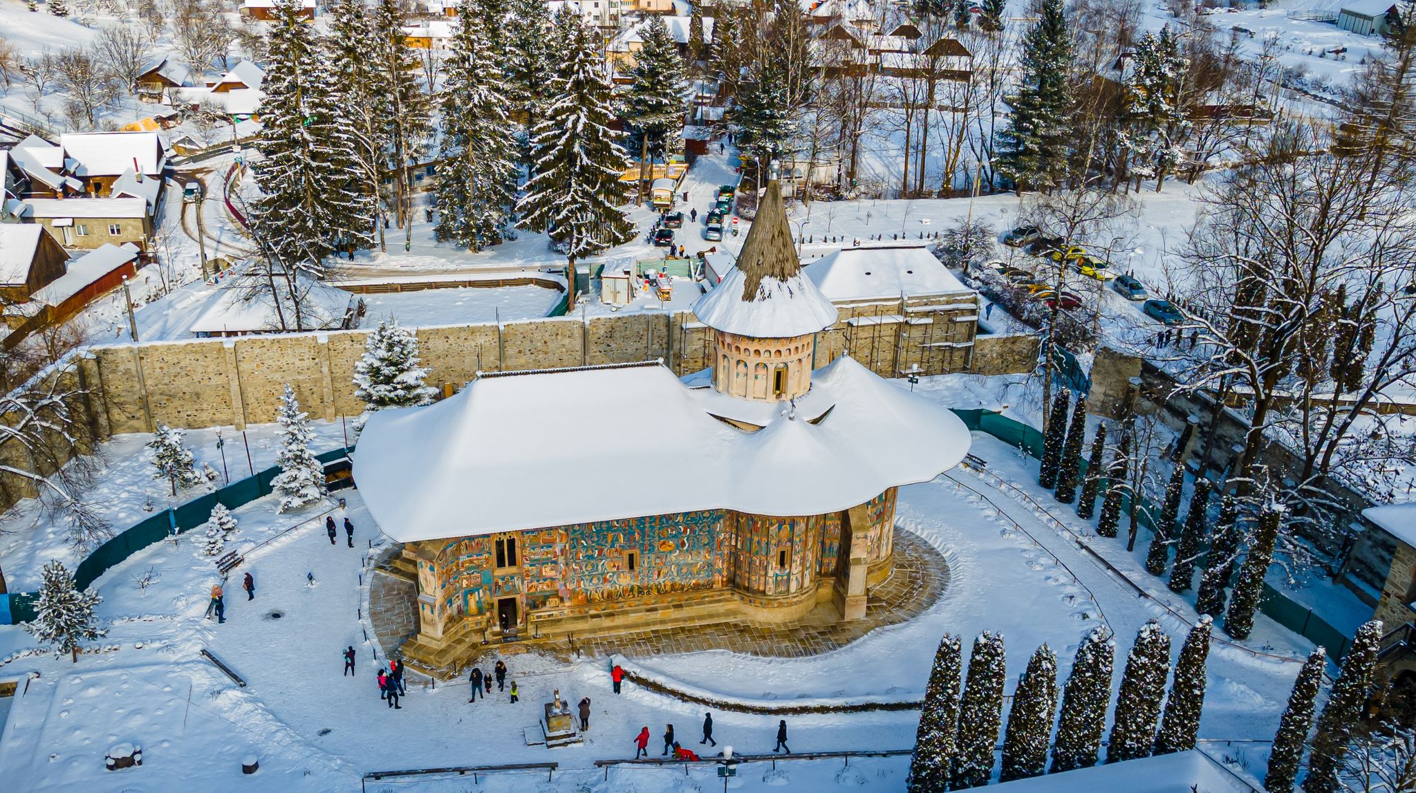 Photo of aerial view of the Voronet Monastery in winter one of Romanian Orthodox monasteries in southern Bucovin, Romania.