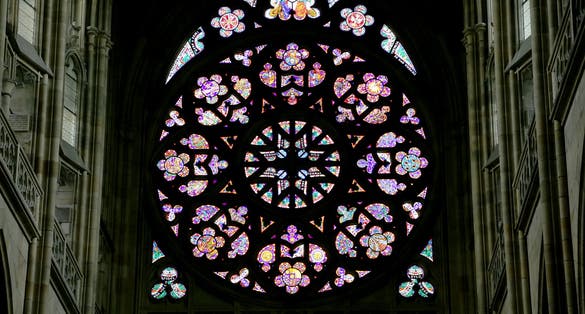 Photo of art Nouveau painter Alfons Mucha Stained Glass window in St. Vitus Cathedral, Prague, Czech Republic.