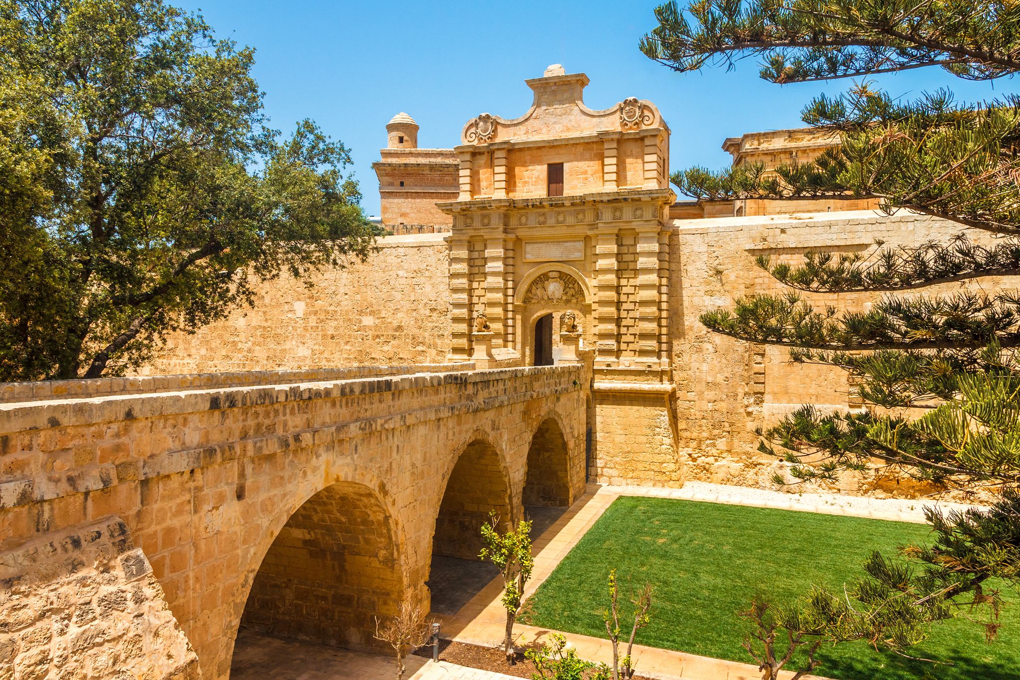 Photo of entrance bridge and gate to Mdina, a fortified medieval city in the Northern Region of Malta.