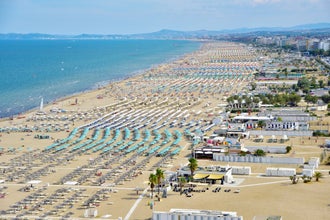 Bay and seafront of Rimini and Riccione with umbrellas in summer