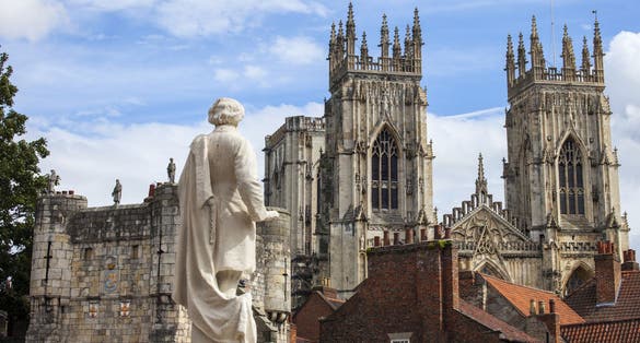 Photo of view from the York Art Gallery taking in the sights of the William Etty statue, Bootham Bar and the towers of York Minster in York, England.