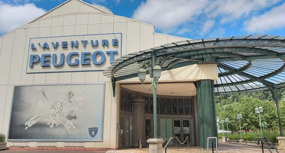 Main entrance of the museum, and Peugeot 406