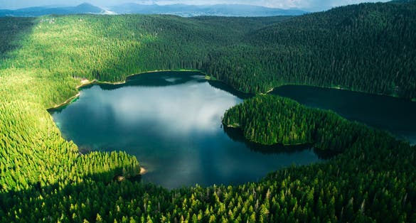 Photo of aerial view at a beautiful Black lake in the mountains, Montenegro.