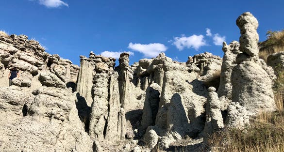 Photo of landscape with rock formation The Stone Dolls (Kameni kukli) of Kuklica near town of Kratovo, Republic of Macedonia.