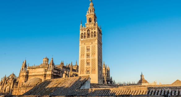 Photo of Giralda is the name given to the bell tower of the Cathedral of Santa Maria de la Sede of the city of Seville, in Andalusia, Spain. At its top is a ball called a jar on which stands the Giraldillo.