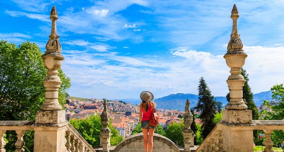 Woman tourist contempling panoramic view of Lamego city- Nossa Senhora dos Remedios in Portugal- distric of Viseu