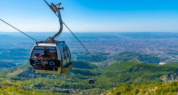 Gondola lift reaching stop at Mount Dajti near Tirana, Albania.