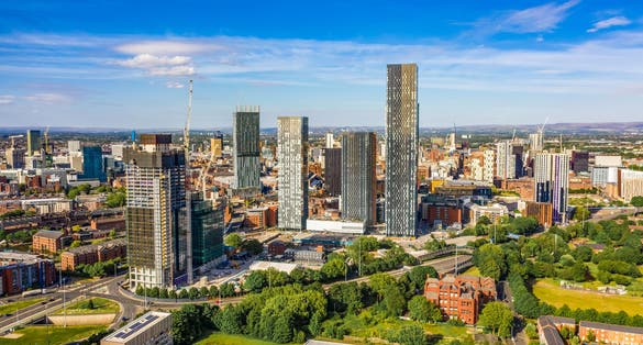 Photo of aerial shot of Manchester UK on a beautiful summer day.