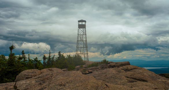 photo of The summit of Hurricane Mountain with the fire tower located on the top in the Adirondack Forest Preserve in New York State