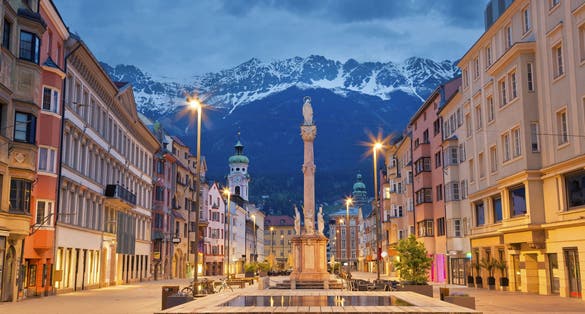 photo of Innsbruck, Austria during twilight with European Alps in the background.