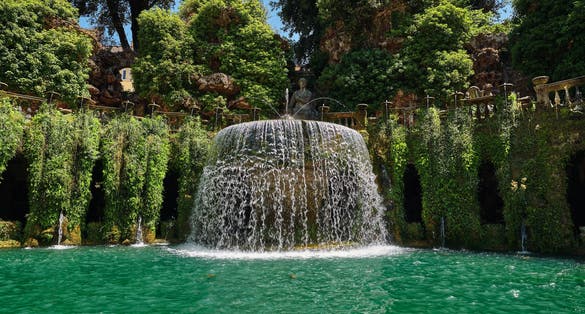 Magnificent fountain with turquoise water in the old park of Tivoli in Italy
