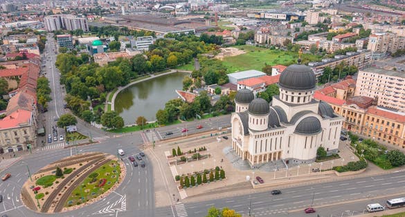 photo of view of Top view of Arad, Romania cityscape with the Orthodox Cathedral and the surounding buidings. Photography was shot from a drone at a higher altitude.