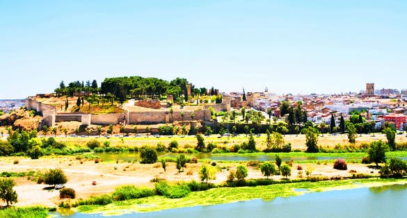 photo of aerial view of the old town of Badajoz, Spain with Alcazaba of Badajoz during the sunny hot summer day.