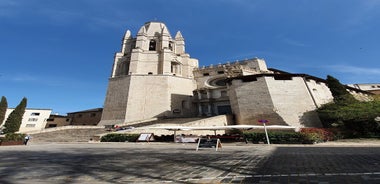 Photo of colorful yellow and orange houses and Eiffel Bridge, Old fish stalls, reflected in water river Onyar, in Girona, Catalonia, Spain.