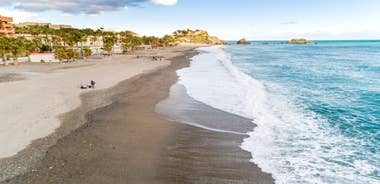 photo of Almuñécar, Spain - A scenic view of a coastal city with white buildings and a blue ocean in the background.