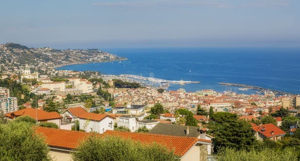 Panoramic view of Sanremo City, Liguria, Italy showing old town "La Pigna", old port and new port and el Santuario Madonna Della Costa.