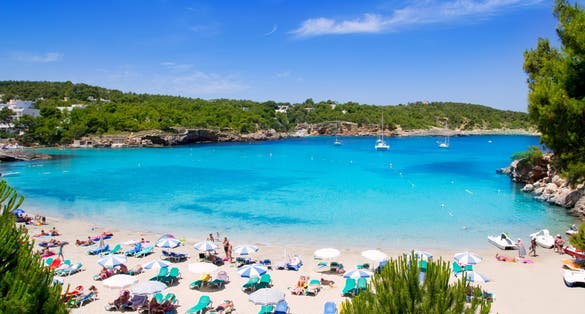Photo of Ibiza Portinatx turquoise beach paradise in Balearic Islands, Spain.