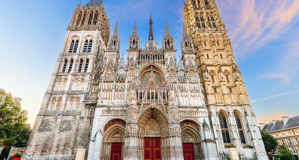 Photo of the west front of the Rouen Cathedral famous for its towers, Rouen, Normandy, France.