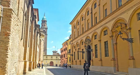 PARMA, ITALY - Colourful buildings leading to Piazza Duomo, beautiful and historic cathedral in main square of the Italian city, Emilia Romagna