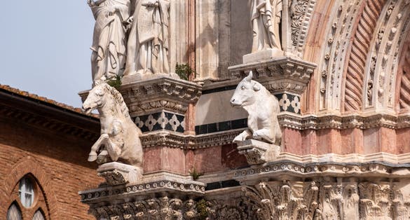 photo of view of Facade decoration of the cathedral of Siena, Italy.