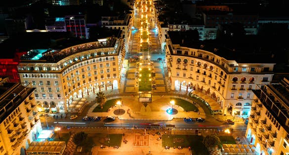 Photo of aerial drone night shot of iconic illuminated Aristotelous square in the heart of Thessalloniki or Salonica, North Greece.