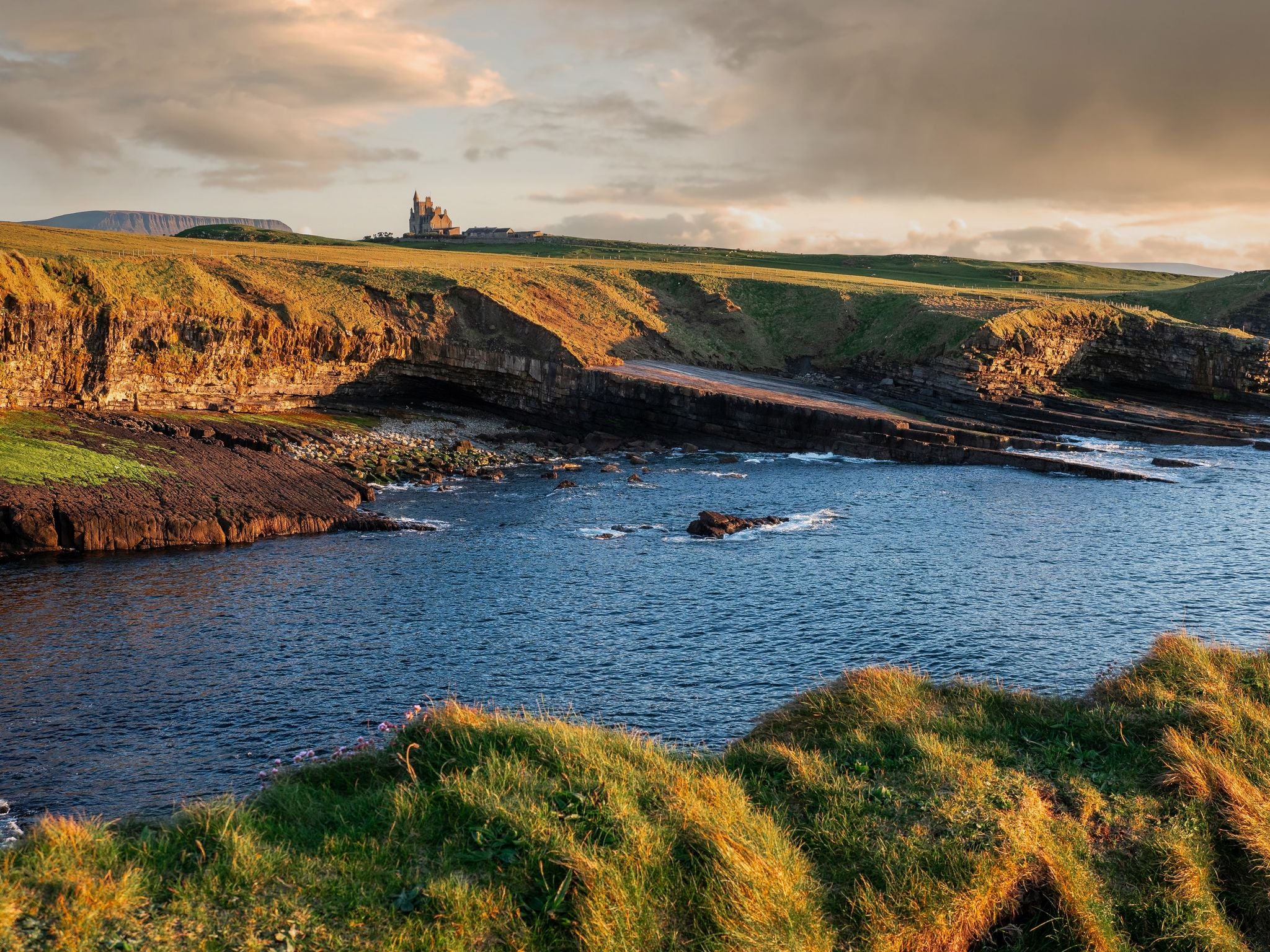 photo of view of Famous Gothic style castle Classiebawn in stunning nature setting in county Sligo, Ireland. Popular travel landmark. Irish landscape. Signature point of interest for tourist.